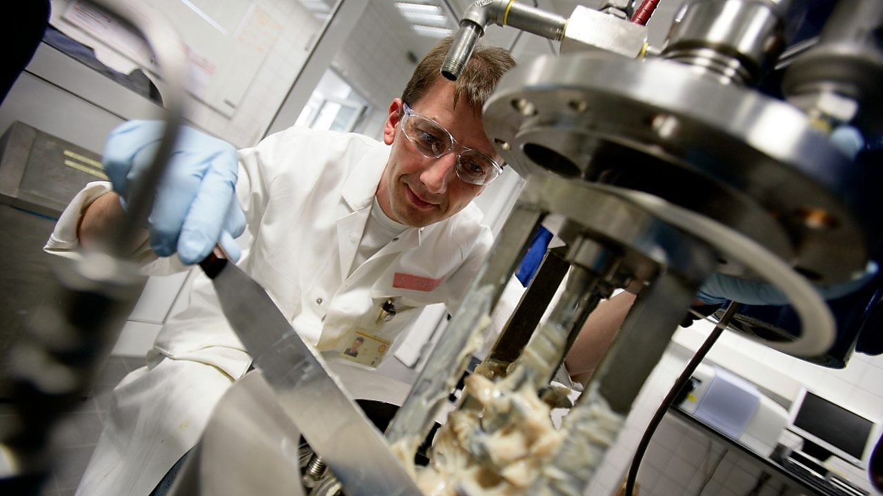 scientist taking grease out from the laboratory