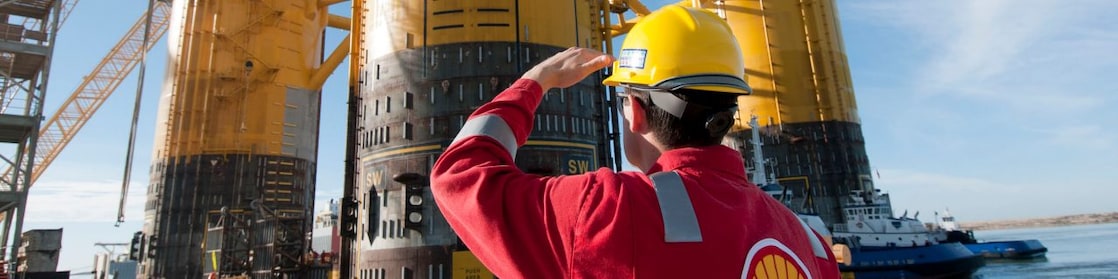 Engineer looking up at platform under construction