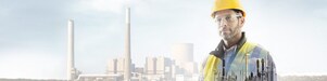 worker in a yellow hard hat transposed onto a background of a power plant