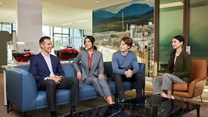Team members meeting in a workplace lounge