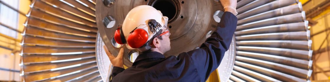 Engineer Inspecting Turbine