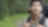 Portrait of Asian male backpacker in the woods