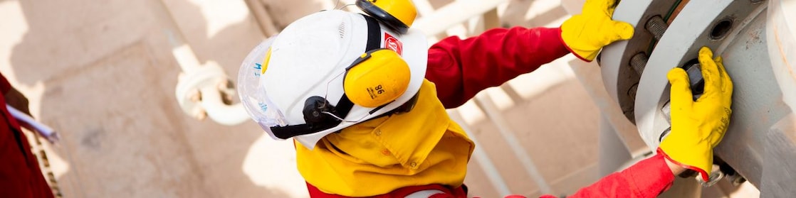 Worker wearing safety mask and gloves
