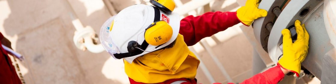 Worker wearing safety mask and gloves