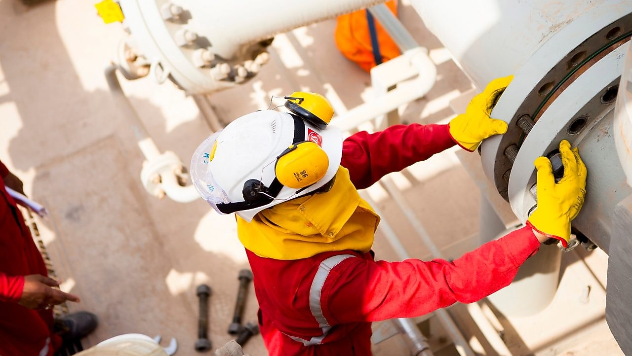 Worker wearing safety mask and gloves 