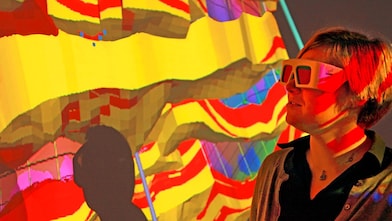 lady wtaching screen with 3d glasses