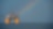 A Shell offshore rig with a rainbow in the background.