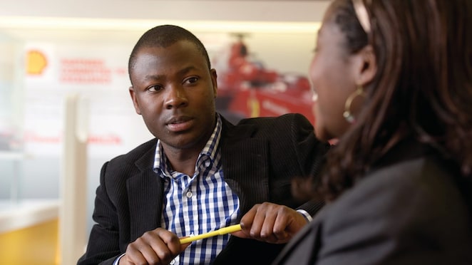 two individuals discussing