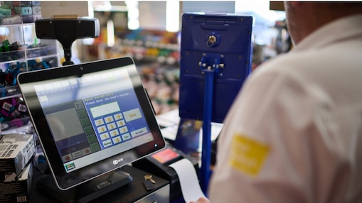 Shell employee at a cash register