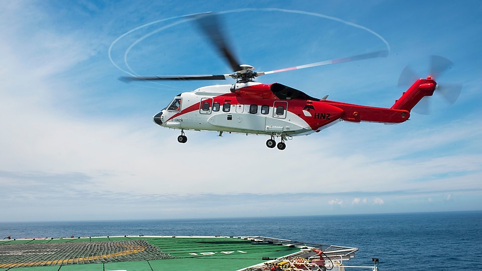 Helicopter landing at rig helipad