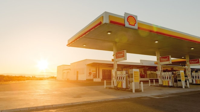 The forecourt of a shell service station at dusk