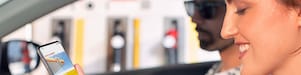 Woman in parked car using Shell EasyPay™