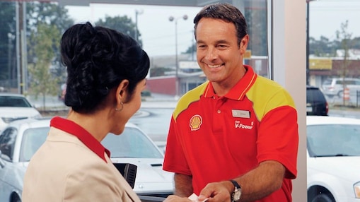 shell retail employee with customer