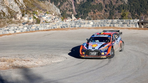 Rally car drifting around a corner in the world rally championship