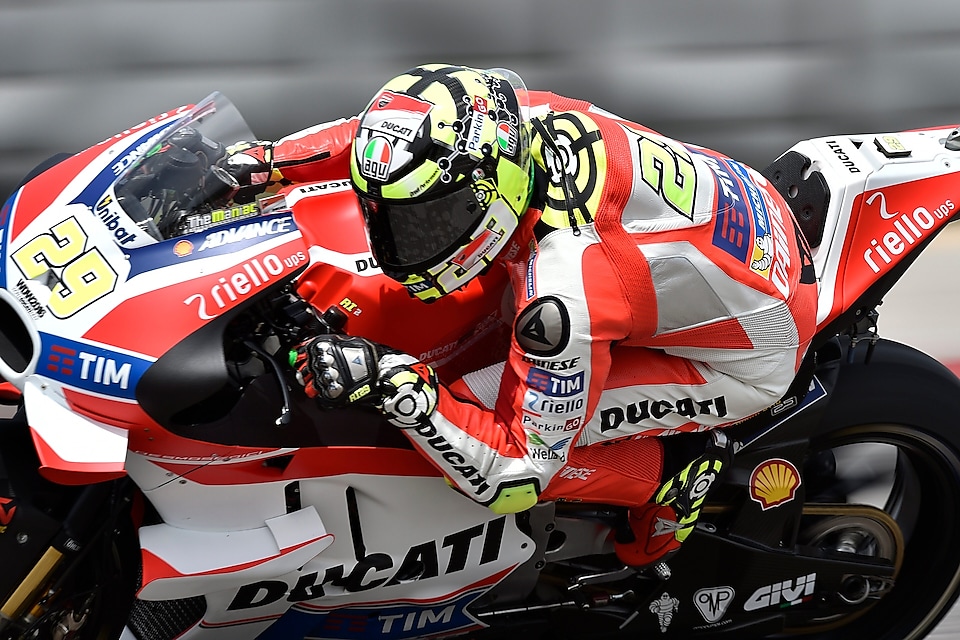 Ducati rider on superbike leaning into a corner whilst racing