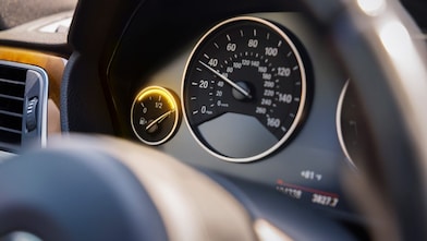 Black car gas gauge with fuel gauge full