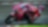 A red Ducati MotoGP bike taking a sharp turn on a race track