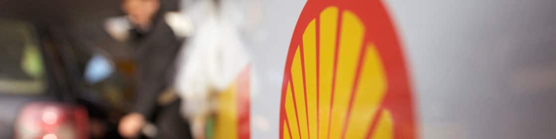 Man filling petrol at gas station