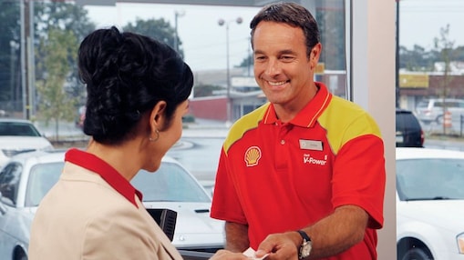 shell retail employee with customer