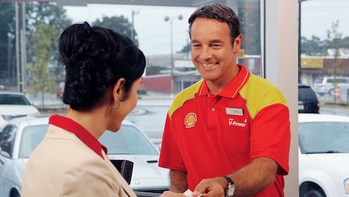 shell retail employee with customer