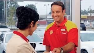 shell retail employee with customer