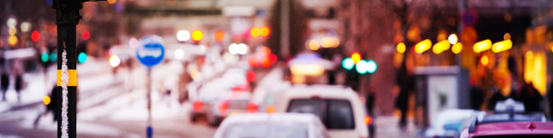 Snow and rain in the evening traffic