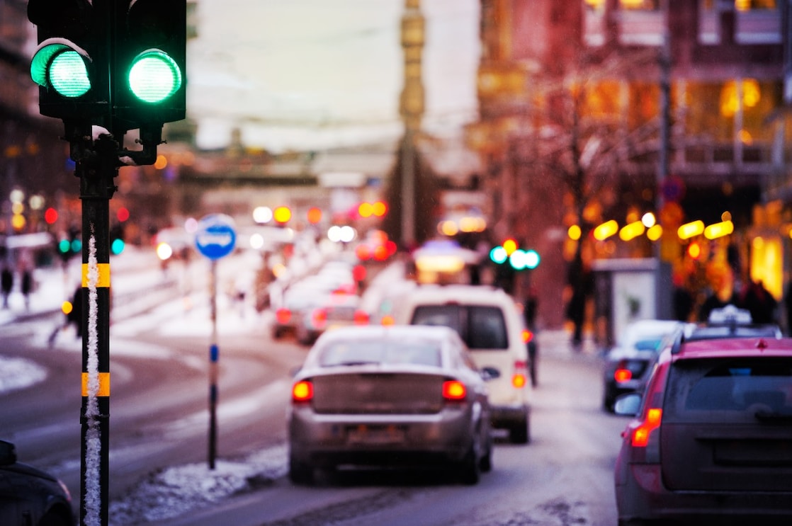 Snow and rain in the evening traffic