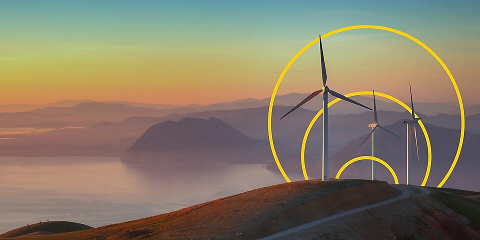 Photo de trois éoliennes sur une colline et le graphique Atteindre la carboneutralité