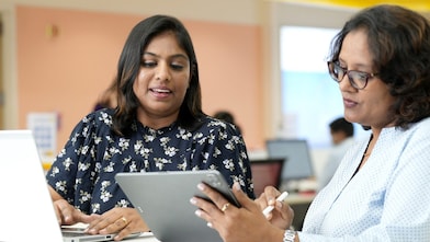 Women working on laptop and tablet