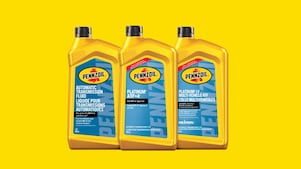 Lineup of three different bottles of Shell Pennzoil automatic transmission fluid.