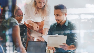 A small group of marketing professionals meeting to use Shell resources to help build their business.