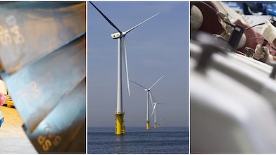 two men working and windmill in center