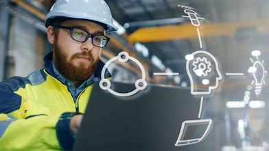 digital overlay on field worker in PPE with laptop
