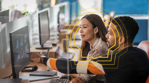 people reviewing data together at a computer