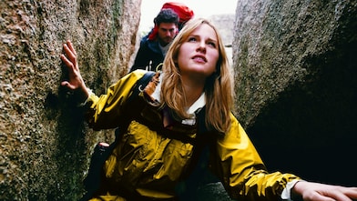 Two People Orienteering Between Rocks