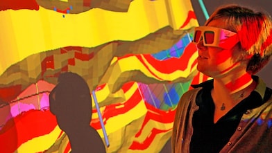 lady wtaching screen with 3d glasses