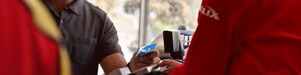 a person is making payment using bmo air miles credit card