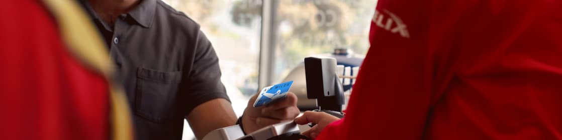 a person is making payment using bmo air miles credit card