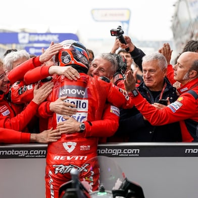 The Ducati team celebrates Danilo's podium in France