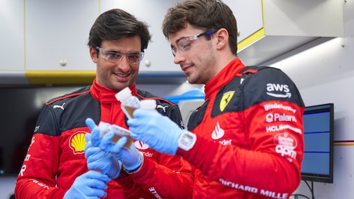 hands holding a v power tube on a shell lab